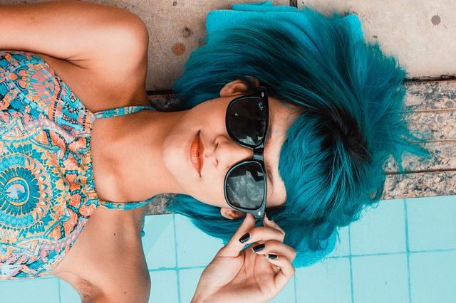 Girl wearing blue on a blue background